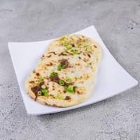 Vegan Refried Beans Pupusa · served with curtido and salsa
