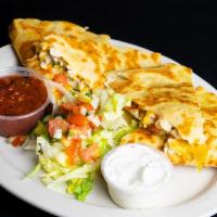 Quesadillas · Grilled flour tortillas with Cheddar Jack cheese and pico de gallo. Served with salsa and so...