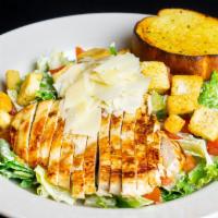 Chicken Caesar Salad · Romaine lettuce, tomatoes, croutons and Parmesan cheese tossed in creamy Caesar dressing and...