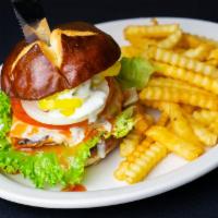 Buffalo Chicken Sandwich · Grilled chicken tossed in buffalo, topped with pepper Jack cheese, lettuce, tomato, onions, ...