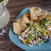 Ceviche · Calamari, tilapia, and shrimp marinated in fresh lime and orange juices, red onion, red and ...