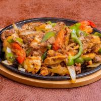 Fajita Mixtas · Mix of steak, chicken and shrimp fajita hot off the grill. Cooked with tomato wedges, pepper...