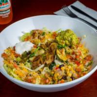 Veggie Bowl · Fresh grilled vegetables, served over Mexican rice, corn salsa, lettuce, guacamole, sour cre...