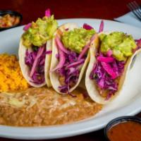 Vegan Tacos De La Casa · Three california style tacos made on soft corn tortillas, filled with pinto beans and topped...