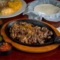 Steak Fajita · Served with tortillas, rice and beans, guacamole, sour cream and cheese.