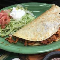 Quesadilla a la Diabla · A large quesadilla filled with grilled chicken and chorizo. Served with rice, beans, lettuce...