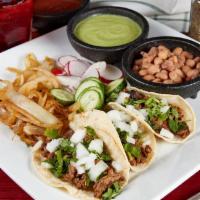 Street Tacos Meal · 3 pieces. Your choice of meat. Topped with onion & cilantro. Served with beans on the side.