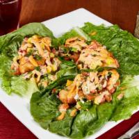 Tacos Frescos · Breaded shrimp or fish served atop a romaine lettuce leaf. Topped with pico de mango & chipo...