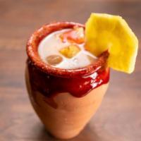 Michelaguas with Cantarito · Our agua fresca with Alteños home made thick chamoy chili powder served on a Mexican cantarito