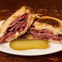 Our Famous Rueben Specialty · Pastrami or corned beef, Swiss cheese, sauerkraut, and Russian dressing on rye. Add french f...
