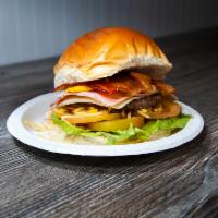 X-Tudo Burger · 100% beef patty, bacon, egg, ham, cheese, lettuce, tomato, sweet corn, potato sticks and mayo.
