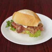 Misto Completo · Ham, bacon, egg, cheese, lettuce, and tomato on a French roll.
