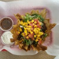 Taco Salad · Shredded lettuce, seasoned taco meat, Cheddar cheese and tomatoes. Served with sour cream an...