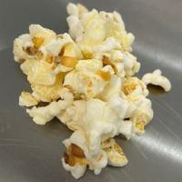 White Cheddar · White Cheddar cheese is tumbled with our White Popcorn for a delicious snack.   