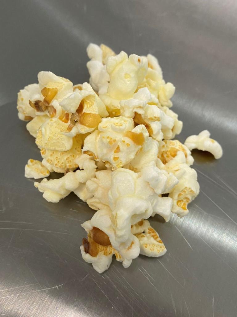 White Cheddar · White Cheddar cheese is tumbled with our White Popcorn for a delicious snack.   
