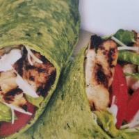 Chicken Caesar Wrap · Grilled chicken breast, tomatoes, lettuce and Parmesan with Caesar dressing.