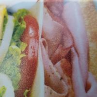 Ham & Swiss · Slow-cured ham and Swiss made the BLIMPIE® WAY with tomatoes, lettuce, onion, vinegar, oil a...