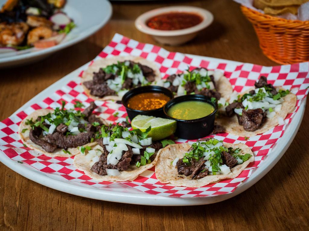 Mini Street Tacos · 6 mini tortillas, stuffed with carne al carbon, grilled chicken or al pastor (marinated pork), topped with onions and cilantro. Served with a side of our special salsa.