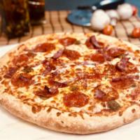 Italian Meat Lover Pizza · Pepperoni, sausage, ham, salami, bacon, and ground beef topped with a blend of provolone, mo...