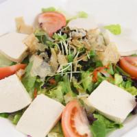 Tofu Salad · Slices of fresh tofu on top of house salad with seaweed, fish flake (katsuo), and radish spr...