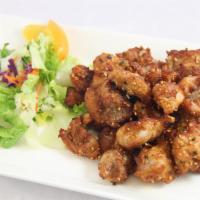 Sesame Chicken · Deep-fried marinated chicken with sesame seeds with teriyaki sauce comes with a small portio...