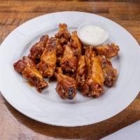 Wings · Tossed in your choice of lemon pepper, BBQ, garlic Parmesan or our signature sauces (Asian f...