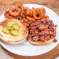 Pulled Pork Sandwich · BBQ pulled pork topped with pickle. Served on toasted bread.