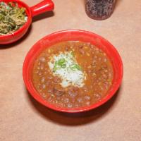 Red Beans & Rice · Our Cajun persuasion dish. Red beans slow cooked and served with premium pit smoked sausage....