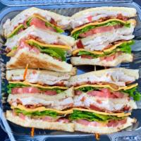 Double Decker Club Signature Sandwich · Oven-roasted turkey breast, smoked bacon, American cheese, lettuce, tomato, and mayo, on you...