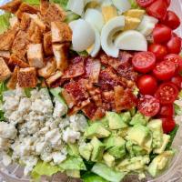 Classic Cobb Salad · Crisp romaine lettuce, chopped oven-roasted chicken breast, smoked bacon, chopped hard-boile...