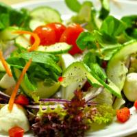 Garden Salad · Crisp romaine lettuce, mushrooms, house croutons, cucumbers, red onions, carrots and tomatoe...