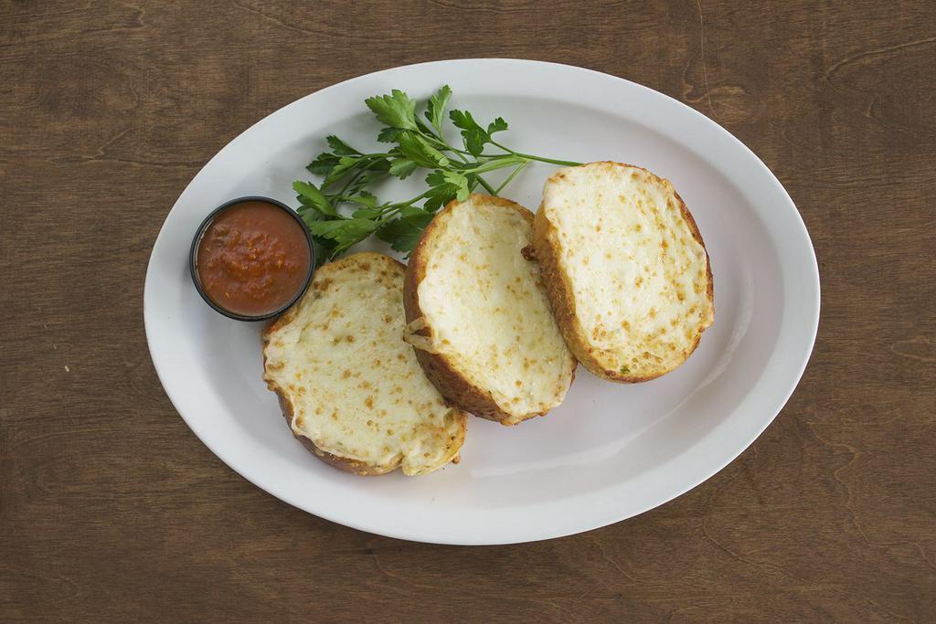 Garlic Cheese Bread · Delicious Garlic cheese bread! Served with a side of Marinara sauce.
