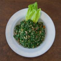 Tabbouleh Salad · Chopped parsley, tomato, cracked wheat, tossed with lemon juice and olive oil.