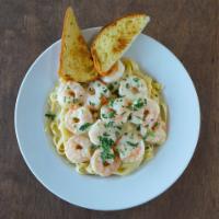 Shrimp Scampi · Shrimp sauteed in lemon,butter, and garlic, served with fettuccine and steamed broccoli
