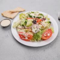 The Greek Salad · A fresh mix of iceberg and romaine lettuce, tomatoes, red onion, cucumbers, carrots, green p...
