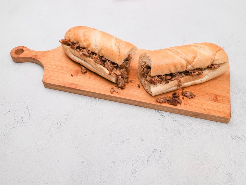 The Philly Cheese Steak Sub · Served on a fresh roll with melted American cheese.
