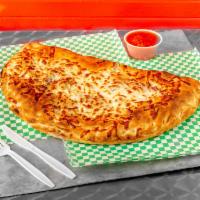 5. Steak Bomb Calzone · Calzones are round whole pan. Topped with blend of cheddar and mozzarella.