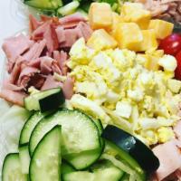 Chef Salad · Mixed Greens, Deli roasted turkey and ham, eggs, cheese, tomatoes, cucumber