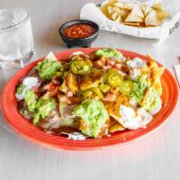 Nachos · Chips Meat jalapeño cheese beans sauce sour cream  and guacamole