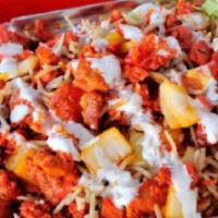Halal Chicken Over Rice With Side Salad · Halal chicken over rice with side salad and choice of sauce.