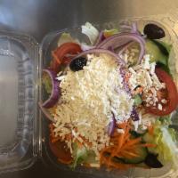 Greek Salad · Iceberg lettuce topped with feta cheese,Greek olives tomatoes,cucumber, red onions,green pep...