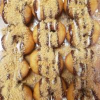 S'mores Mini Donut · Chocolate Drizzle, Marshmallow drizzle, topped with graham cracker crumbs!
