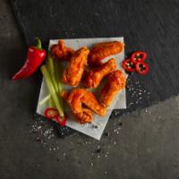 Spicy Chicken Wings · Breaded chicken wings tossed in hot spicy sauce (7 Pcs)