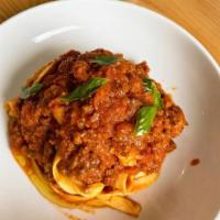 Fettuccine Bolognese Pasta · Beef ragu, pomodoro sauce, basil, and aged Parmigiano.
