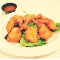 Coconut Shrimp · 8 pieces. Fan-tailed jumbo shrimp battered in Hawaiian coconut and fried until golden brown ...