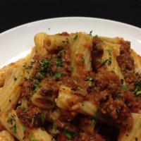 Rigatoni Bolognese · Bolognese sauce in ground beef, served over Rigatoni pasta.