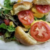 Beef sliders · Three mini burgers with cheddar cheese, dill pickles, mustard served with tossed salad with ...