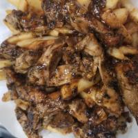 Jerk Fries · Hand-cut fries placed in a basket then topped with Seasoned Jerk Chicken breast chopped up a...