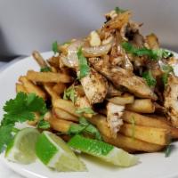 Mojo Fries · Hand-cut fries placed in a basket then topped with seasoned grilled chicken tossed in mojo s...
