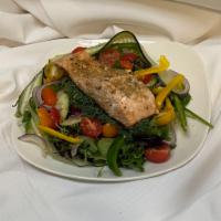 Salmon Salad · Seasoned grilled salmon set on a bed of romaine, iceberg & arugula lettuce. Served with Roma...